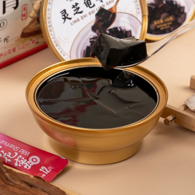 Buon prezzo Bevande e dolci salutari Ganoderma lucidum Guiling Jelly Medicina a base di erbe tradizionale Migliora il sonno Alleviare lo stress in linea